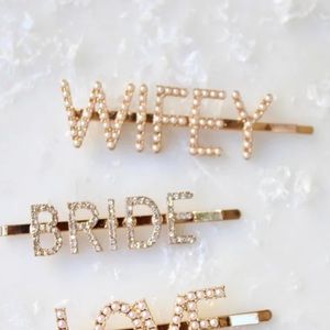 Untamed Petals pair Pearl WIFEY and Diamond BRIDE hair clips